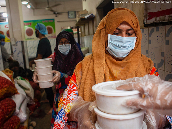 Religious workers passing food.