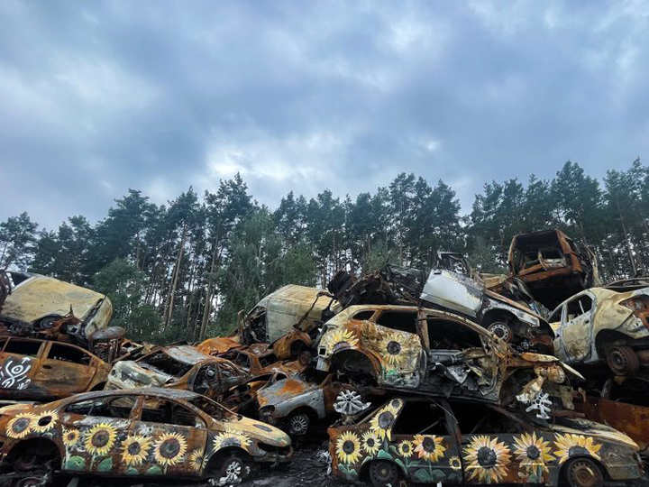 Burned-out cars in Irpin, Ukraine. Photo courtesy of Anna Cave.