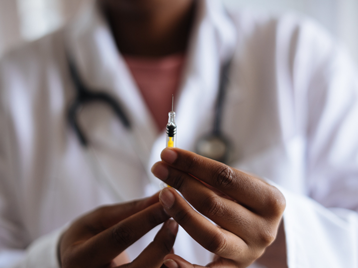 Doctor holding a vaccine