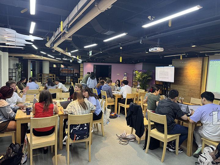 Students preparing group projects at Tsinghua