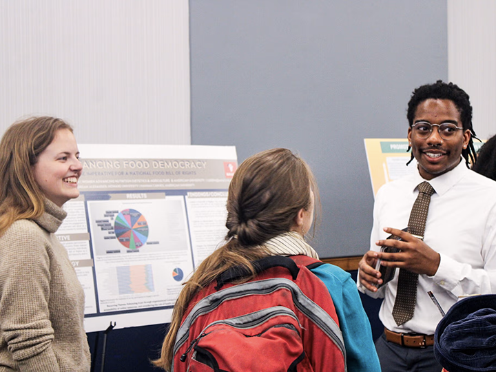 Students presenting at the symposium