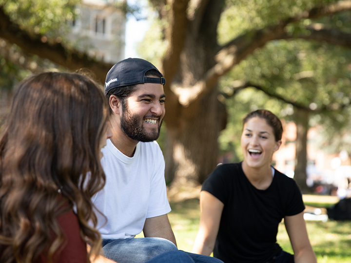 Students talking on the lawn