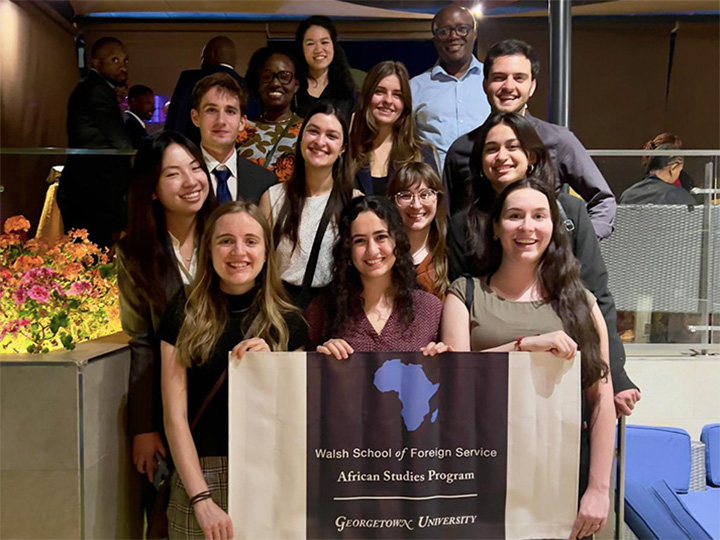 Georgetown students at a alumni reception in Nairobi, Kenya with Associate Professor Ken Opalo
