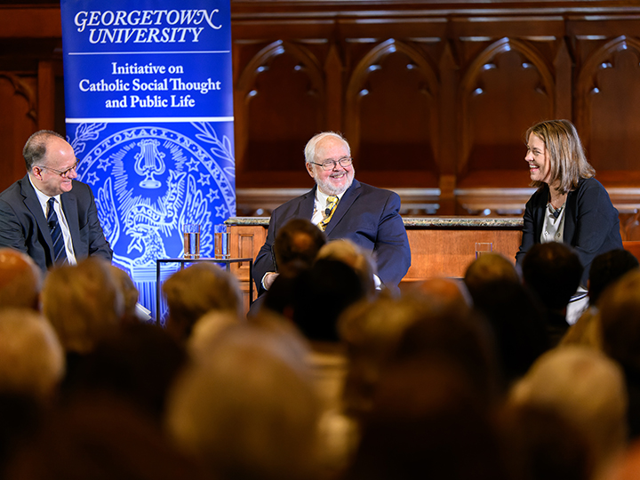 John J. DeGioia, John Carr, and Kim Daniels seated in Dahlgren Chapel on February 28, 2023.