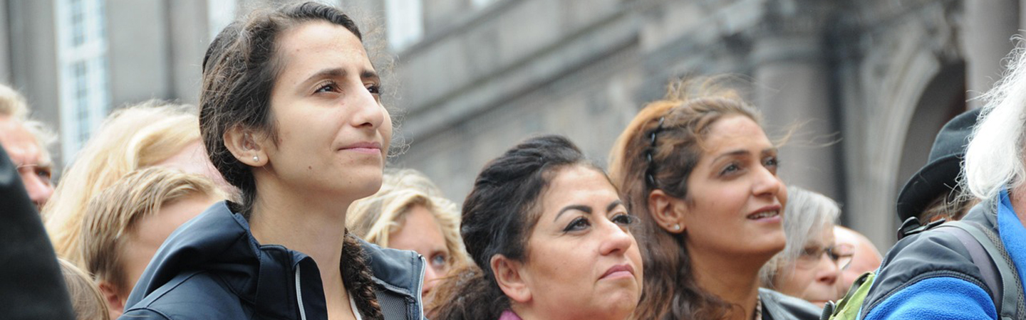 Women demonstrating in support of refugee rights.