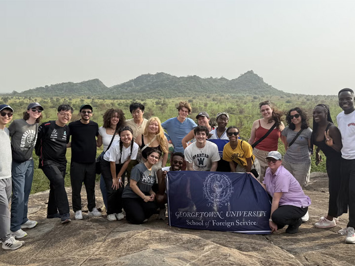 Georgetown University students pose for a picture during a spring break trip