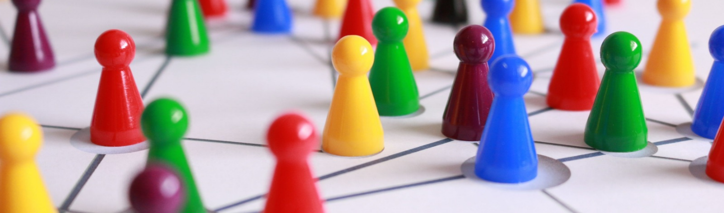 Colorful wooden figures on a white surface