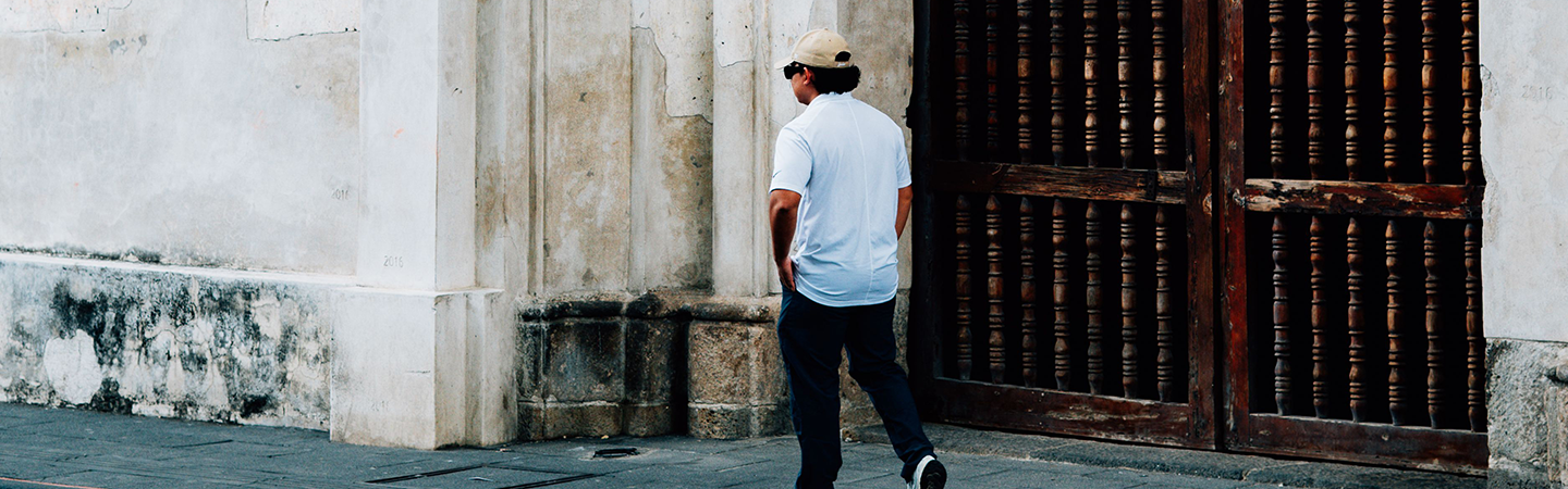 Man walks in front of church door