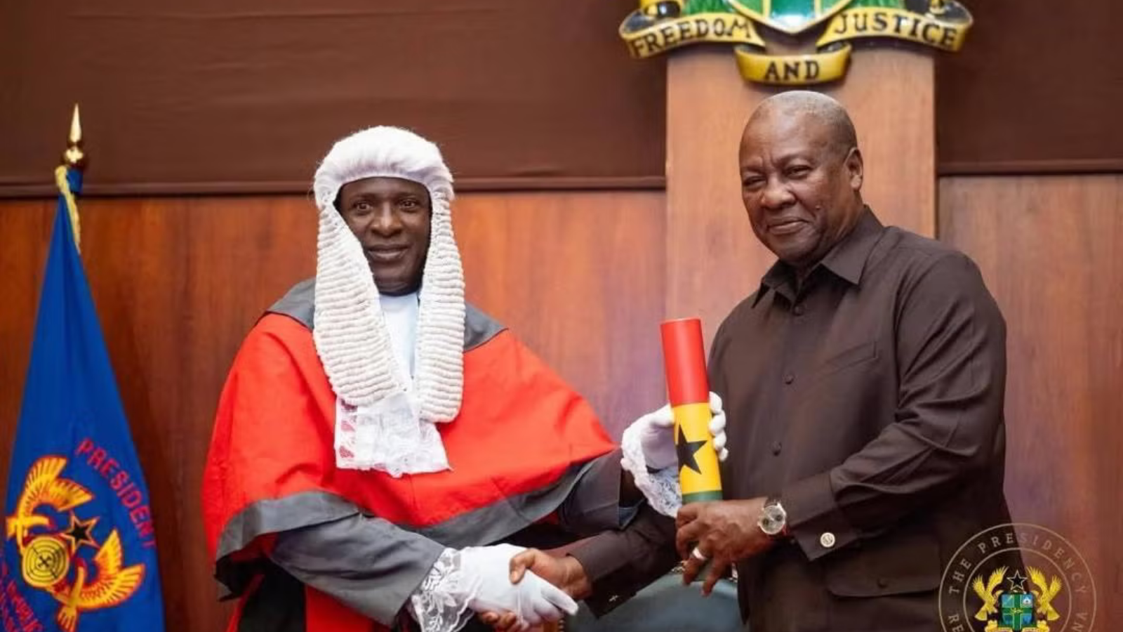 Bedima Duut shaking hands with a judge