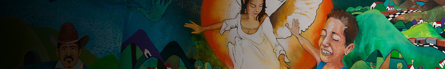 Mural in San Francisco depicting an angel watching over a town and a young boy