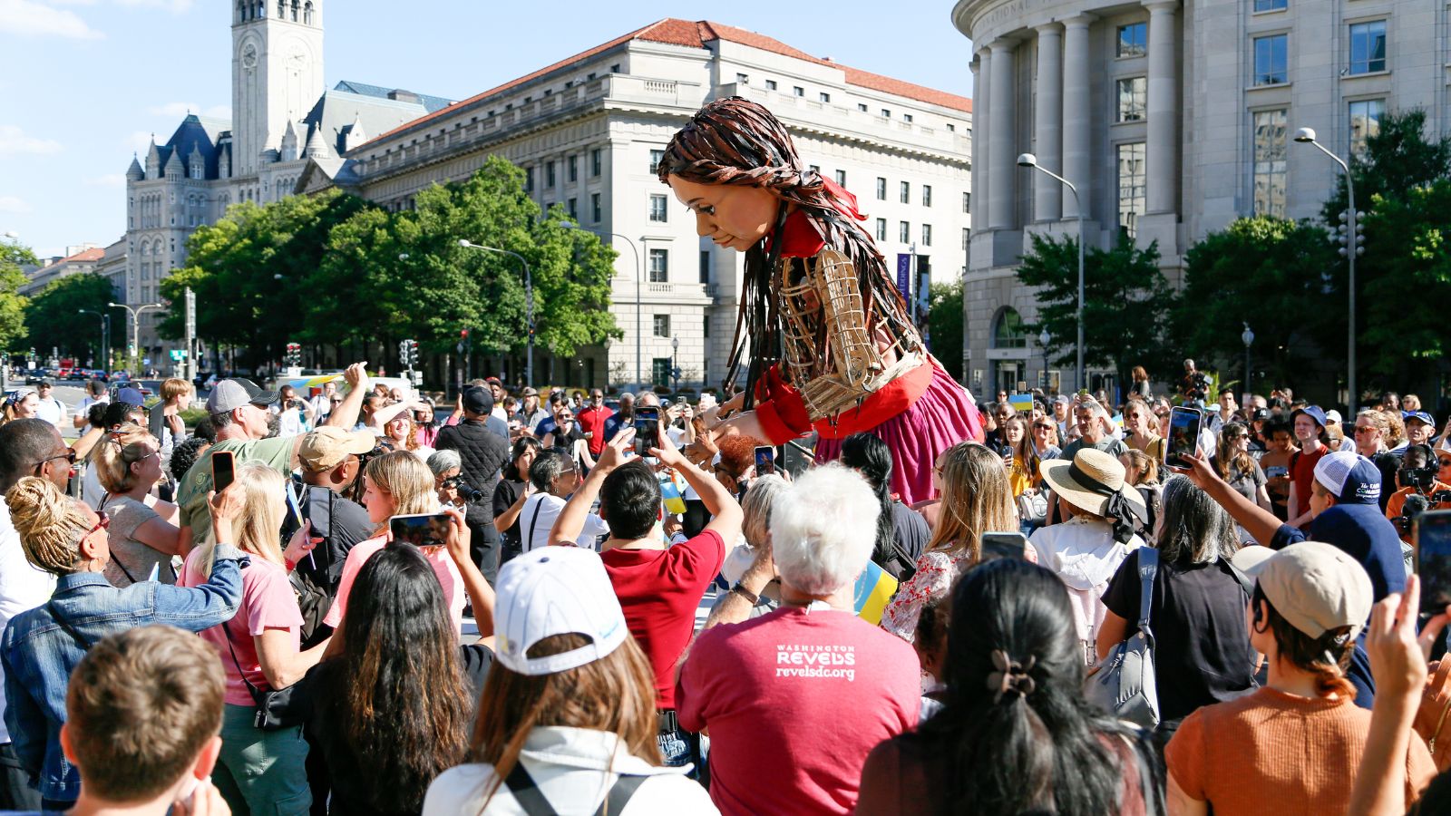 Amal surrounded by a crowd