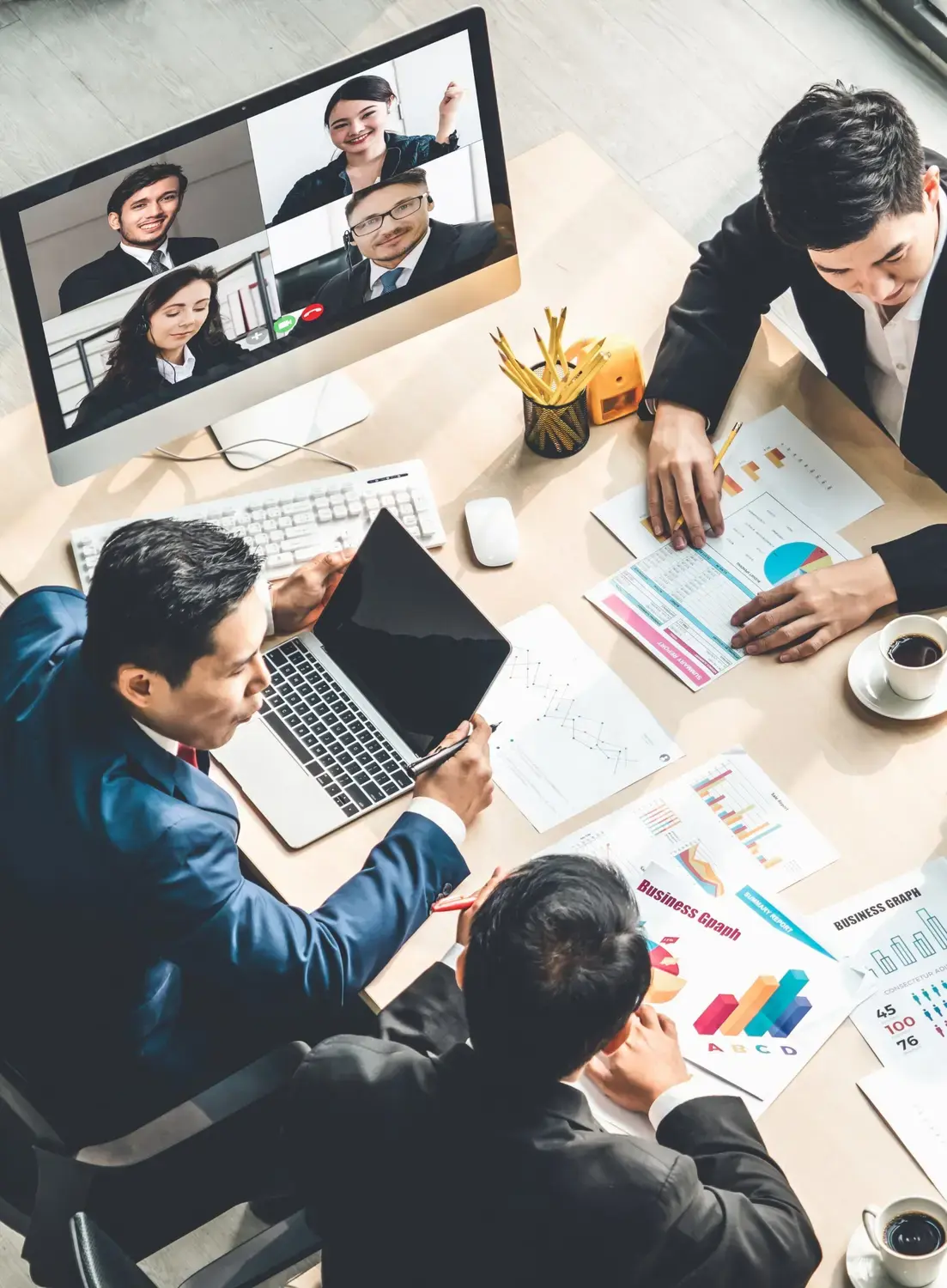Virtual collaboration between two office spaces via video conferencing.