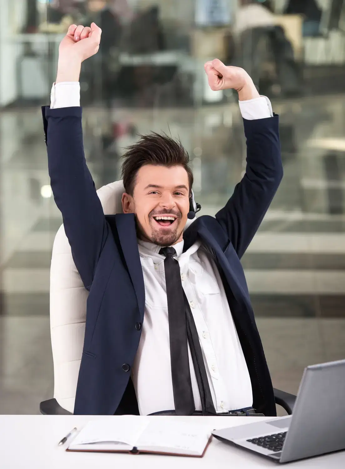 Outbound call center agent excitedly raising hands in triumph.