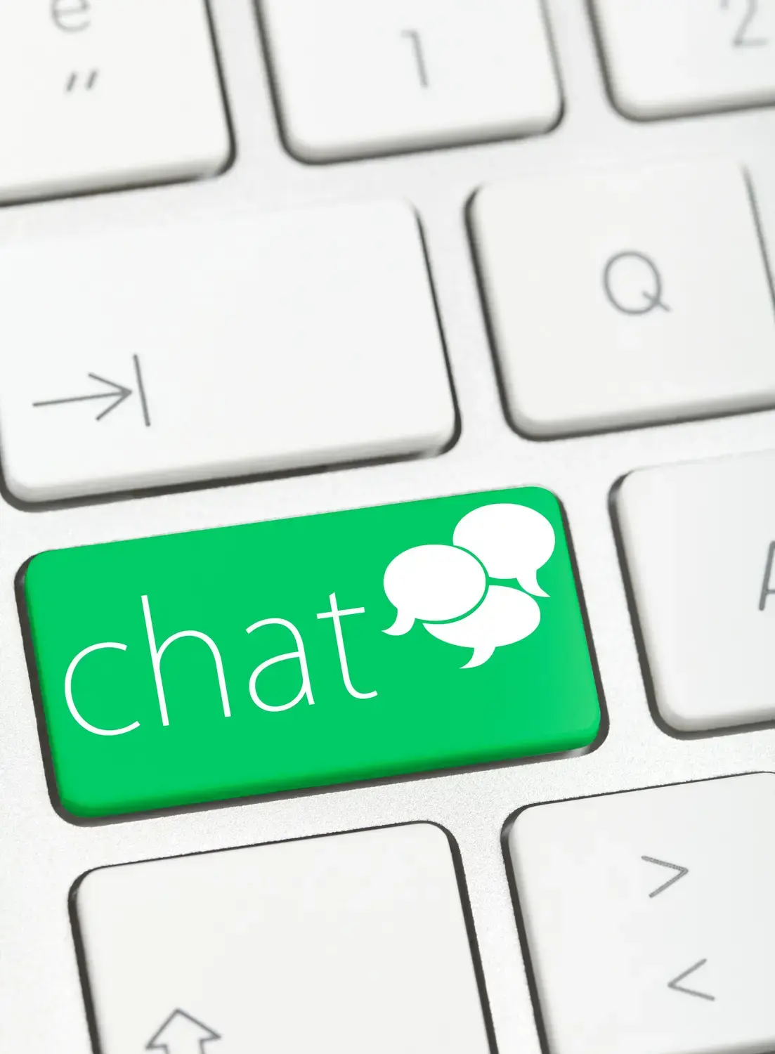 Close-up of a keyboard with a distinct 'CHAT' key highlighted, symbolizing direct access to live chat support.