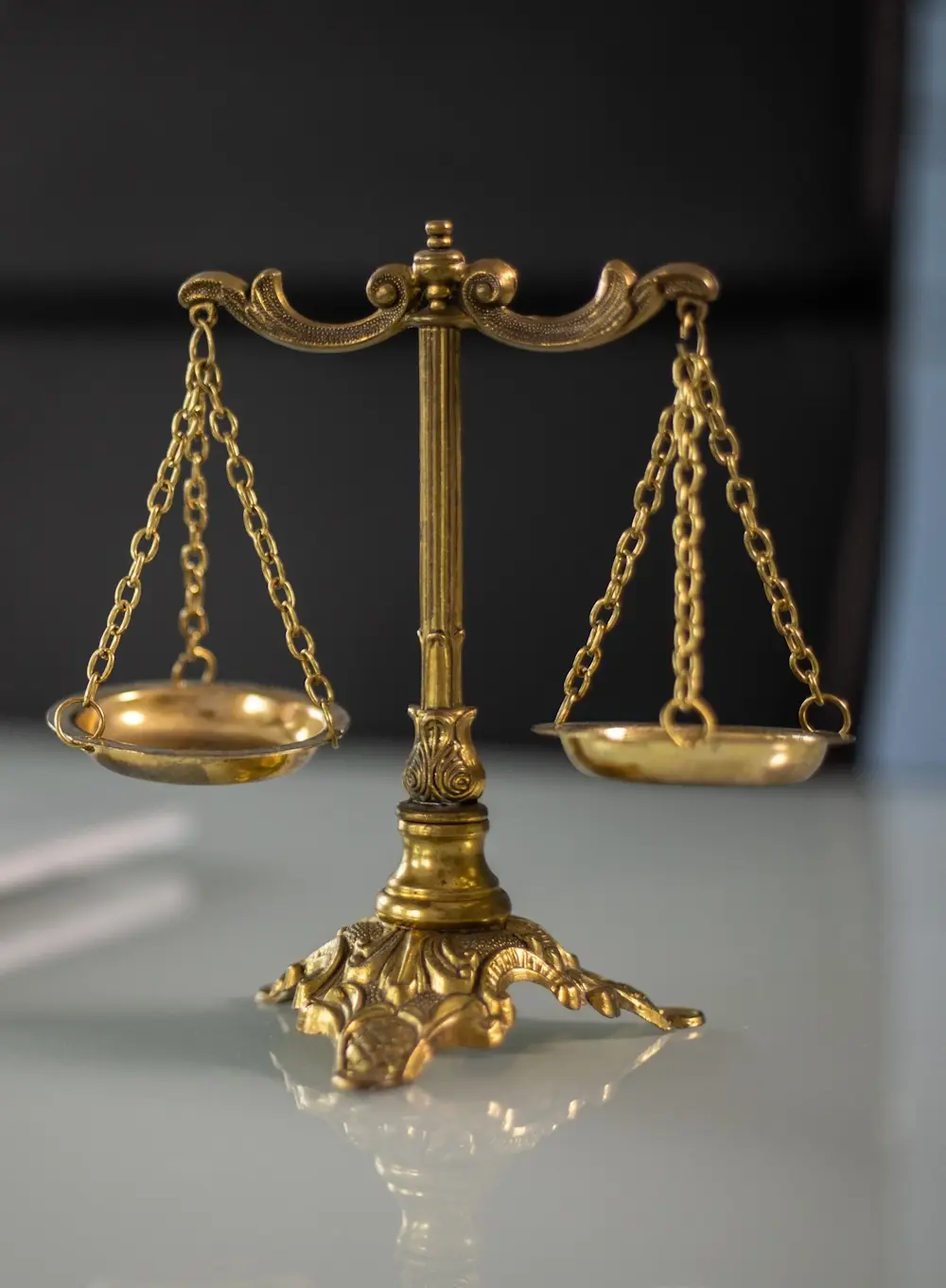 Scales of justice representing fairness, inclusivity, and accessibility in bilingual legal intake processes.