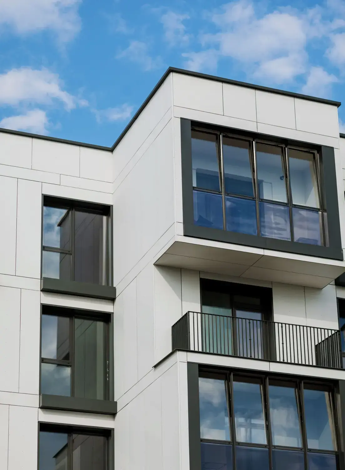 Professional call center handling property management calls. Modern apartment complex with rooms for rent.