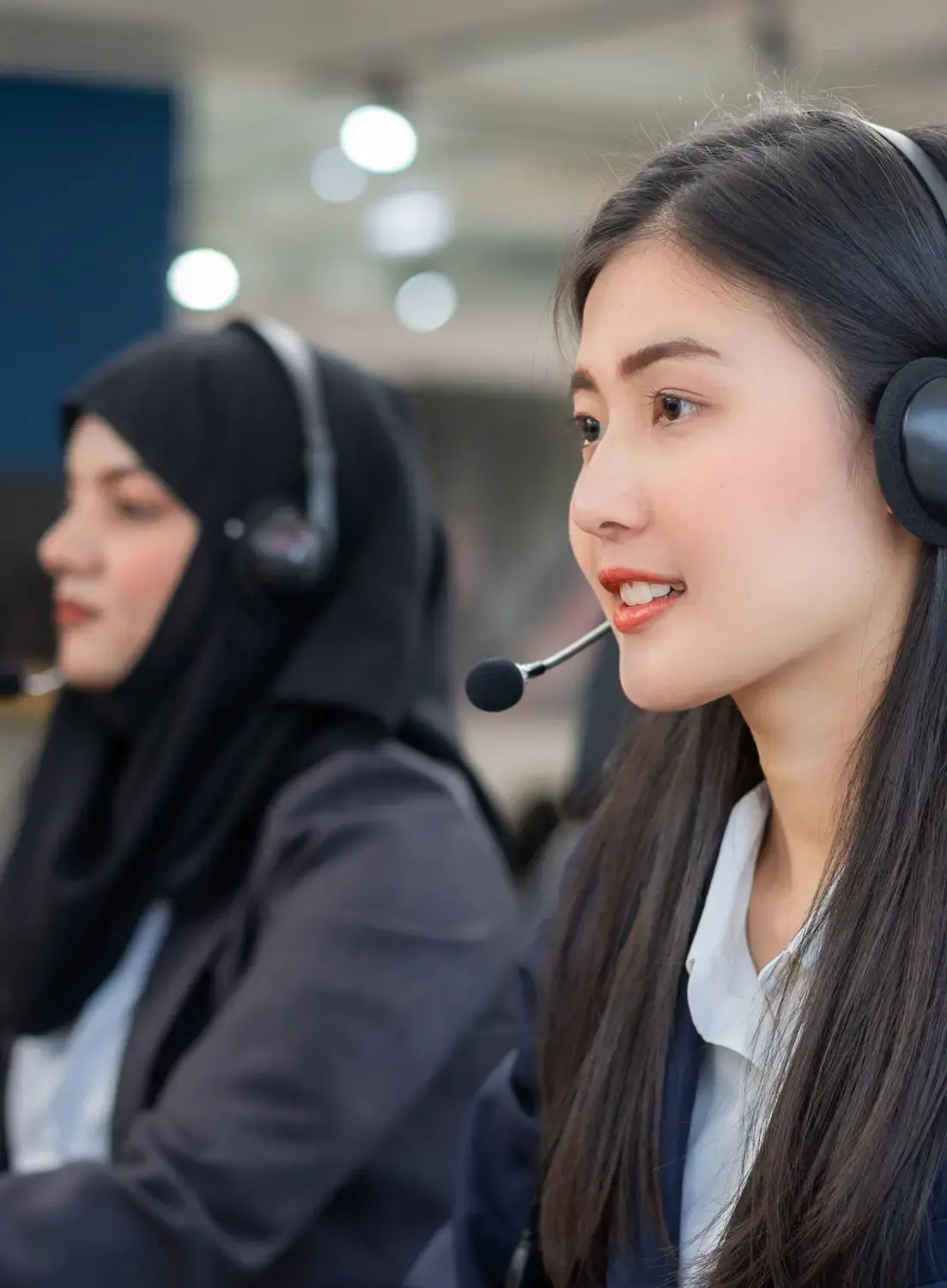 Focused customer service representatives at a top-tier outsourced call center, ensuring high-quality support.