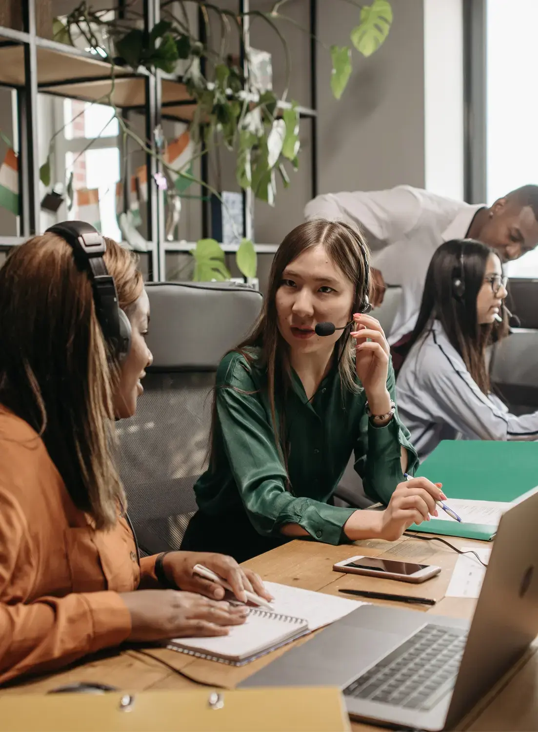 Team of professionals operating in a hosted contact center environment with advanced digital tools.