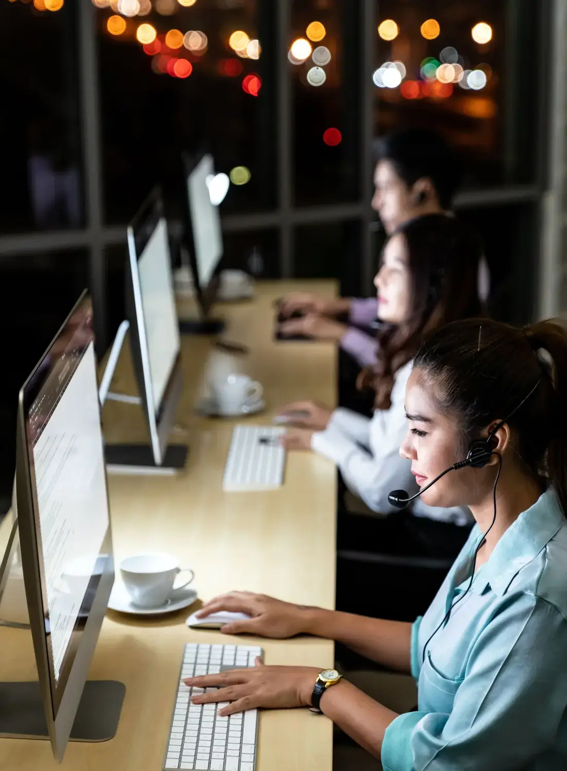 Night view of a bustling call center representing the seamless integration of Salesforce and call center technologies.