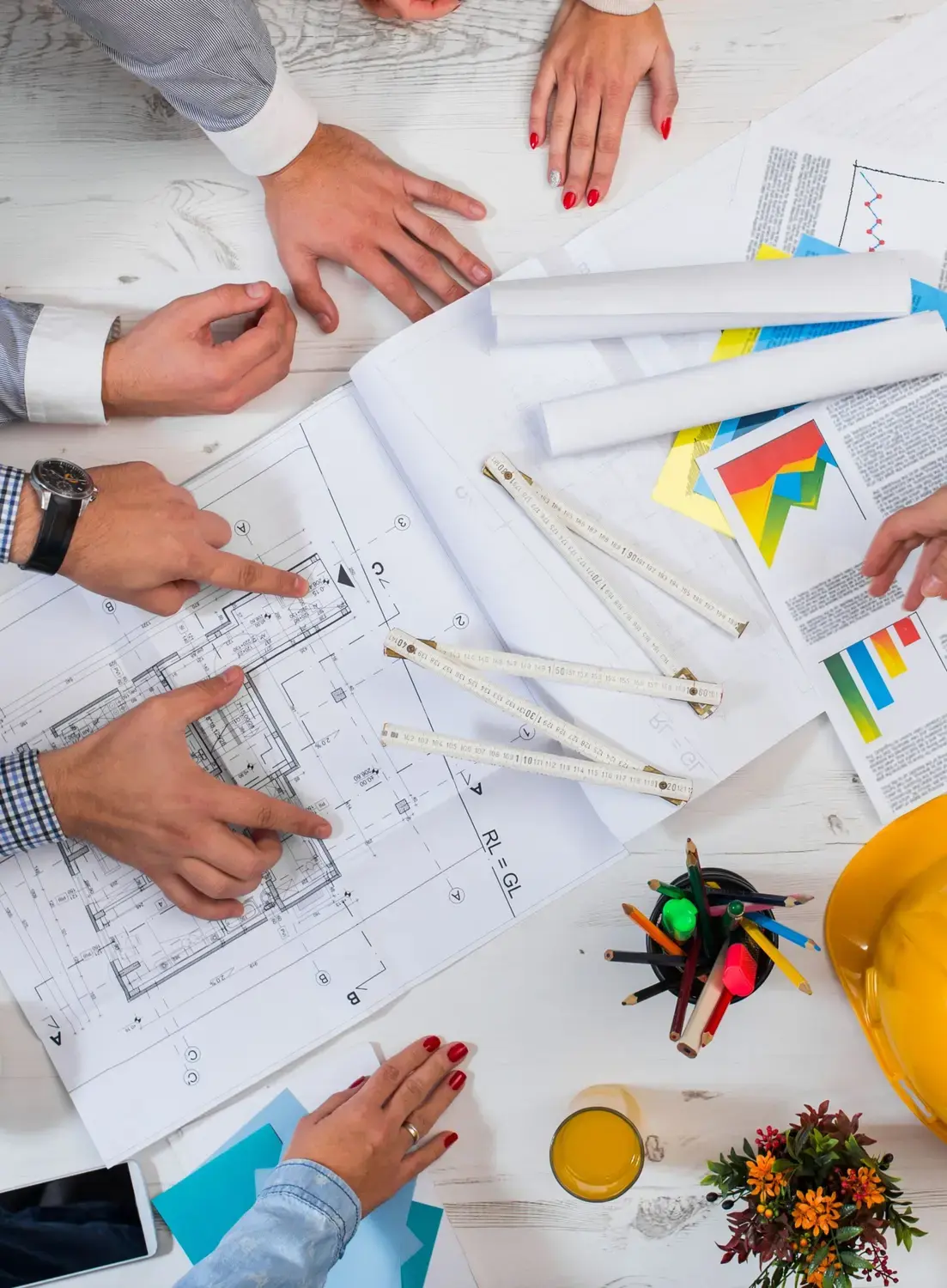 People looking over blueprints