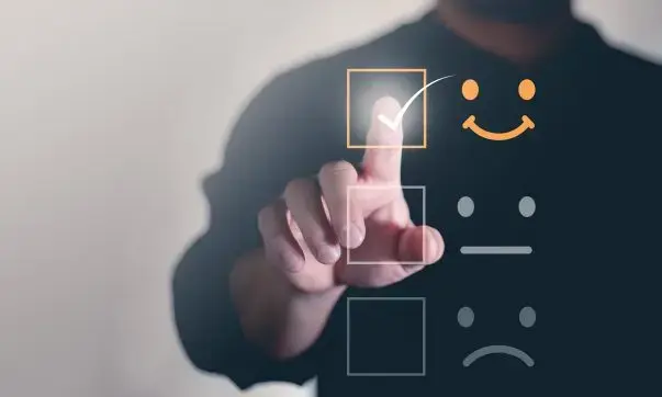 Man clicking on a digital satisfaction survey, providing feedback to help improve customer experience.