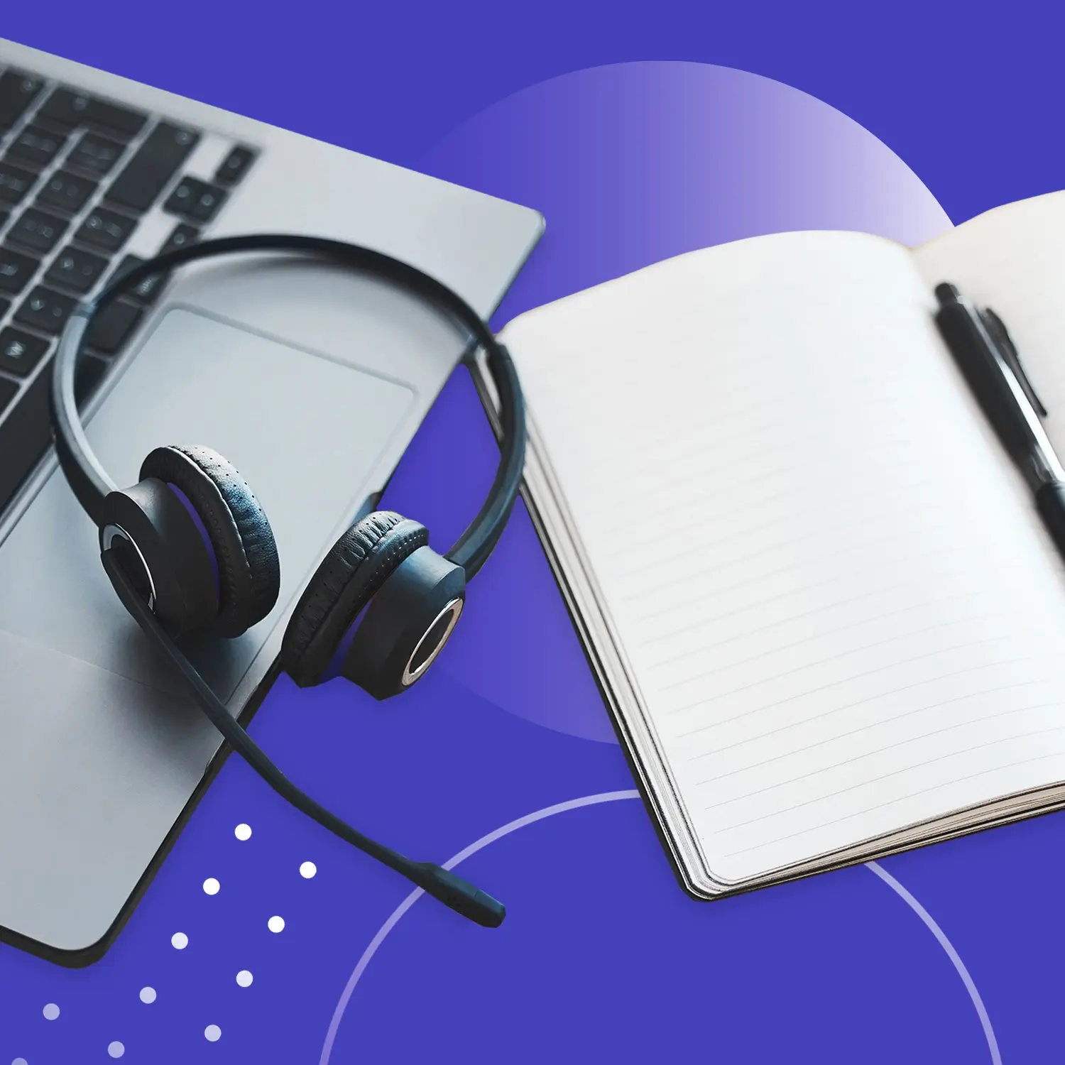 Headset on a laptop beside an open notebook and pen, representing knowledge base documentation and support workflows.