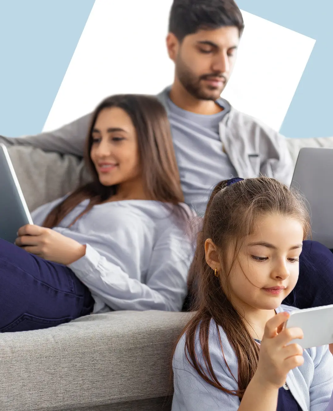 Family using a tablet, laptop, and smartphone at home, illustrating modern screen-first viewing habits and digital eye strain.