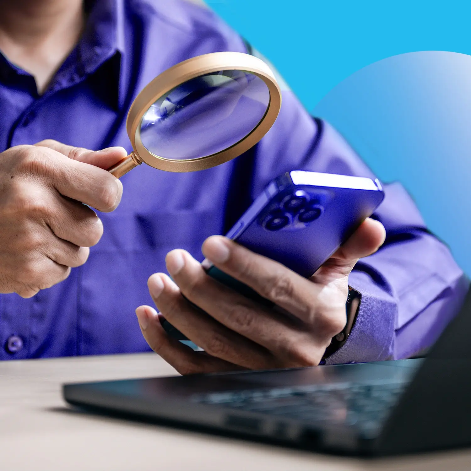 Person holding a smartphone and magnifying glass next to a laptop, representing phone attribution analysis.