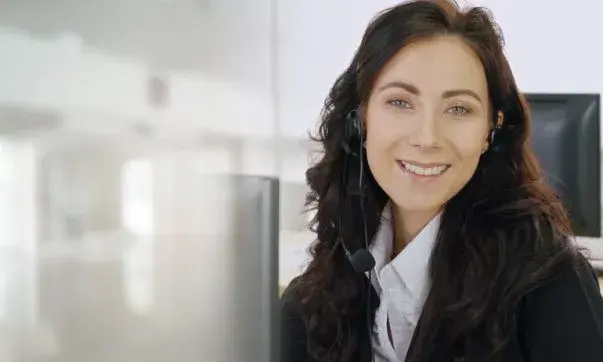Female virtual receptionist professionally managing calls and client inquiries from a remote location.