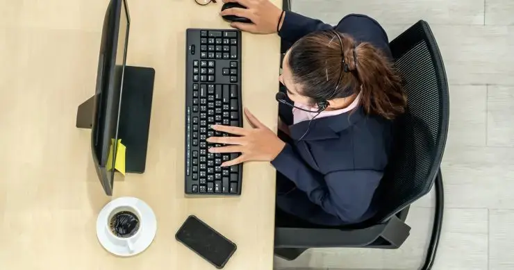 Top down view of virtual receptionist taking customer calls