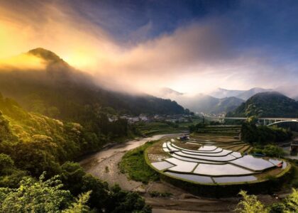 Old vs new: rice paddy next to highway: Uranus in Taurus with Jupiter-Saturn in Aquarius. Courtesy of Wallup.net