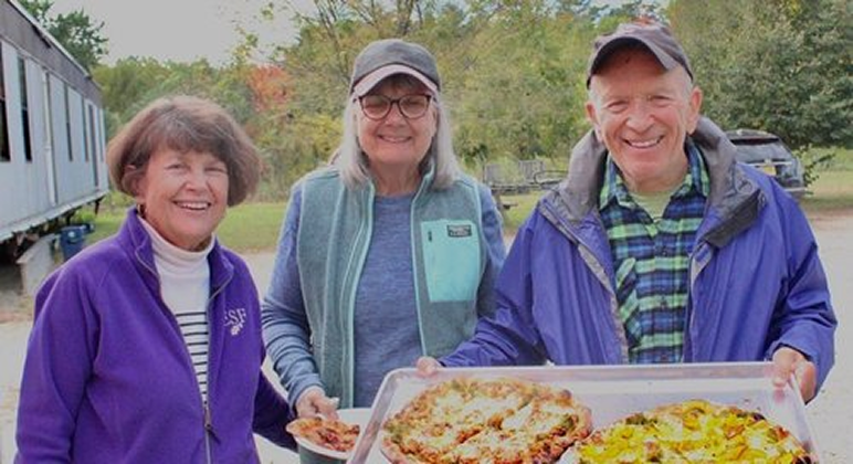 People holding pizzas at brookford farm