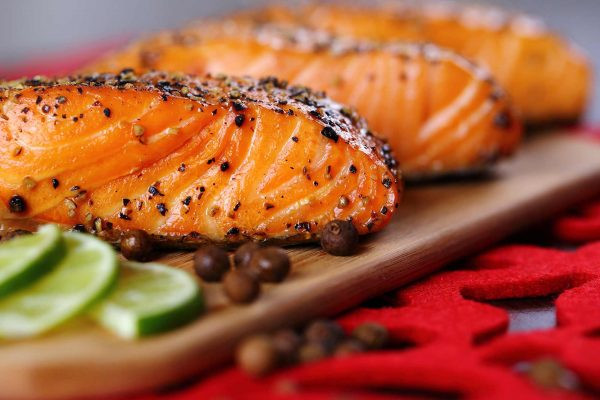 Three grilled wild-caught salmon fillets — no color added, natural color from a wild diet