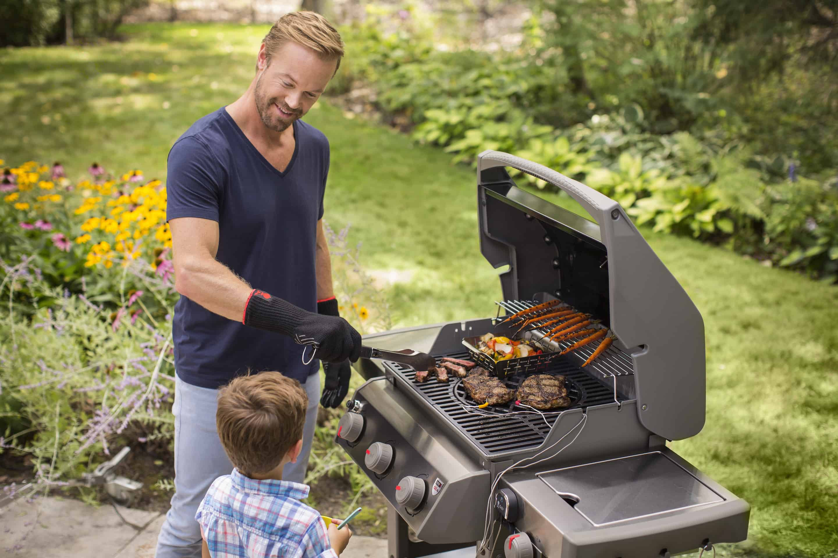 Father and son grilling 100% grass-fed beef from Ferguson Farms — last-minute Father's Day e-gift card