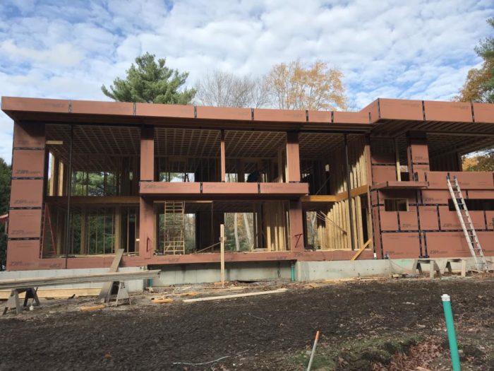 How do I insulate steel support beams in a wooden framed house