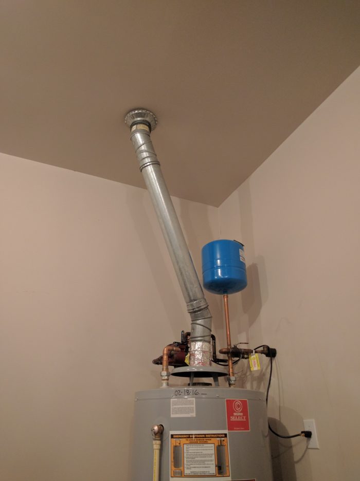 Opencell foam contacting a water heater flue GreenBuildingAdvisor