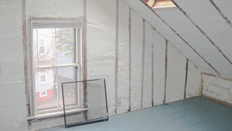 Photo showing an attic insulated with spray foam.