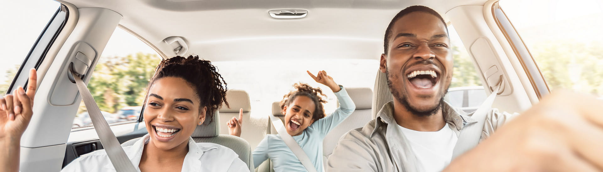 Family having fun in their car