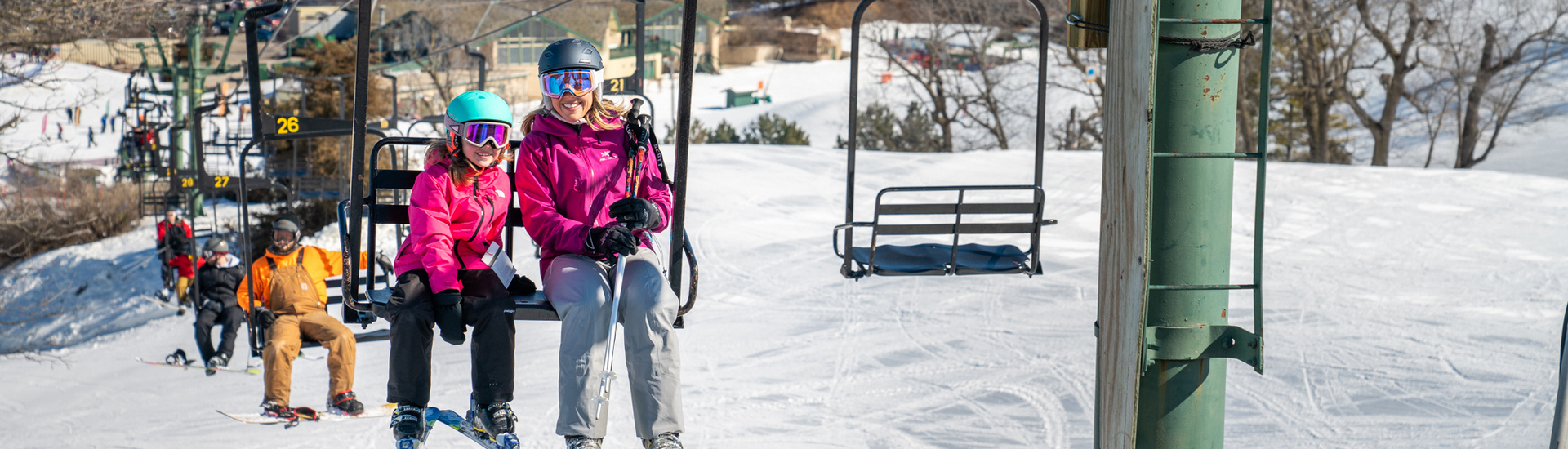 Mom and daughter on the ski lift