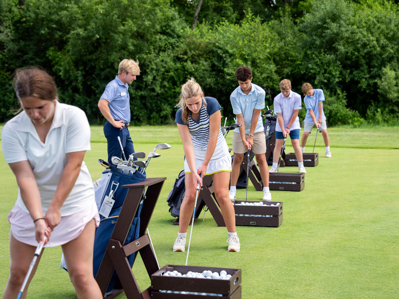 Group of kids enjoying a golf lesson