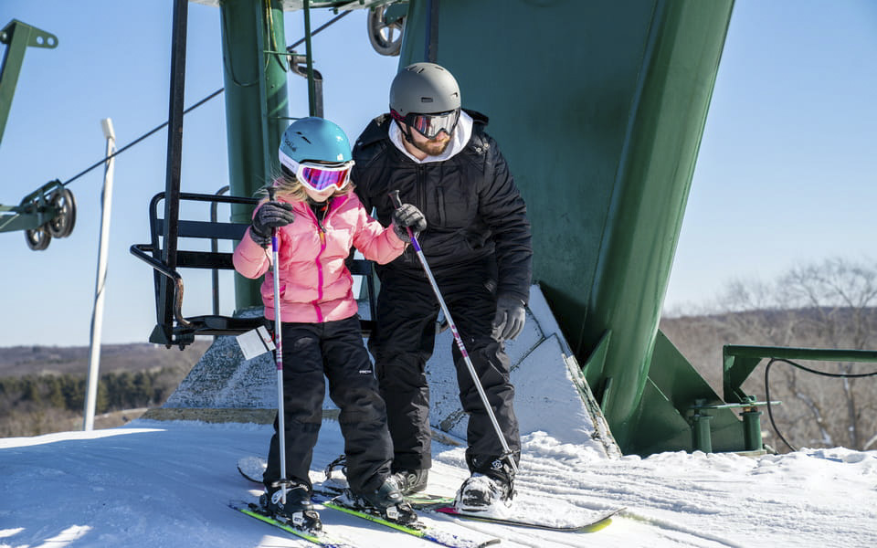 Father and daughter skiing