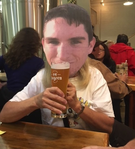 The cardboard cutout tying one on