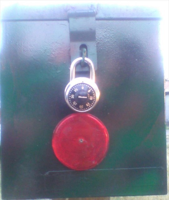 Geocache Box on Fence Post.