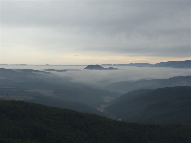 Ostrets peak floating like a mystical island in the fog