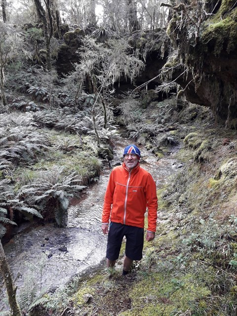 Turn left and walk upstream to the second cave