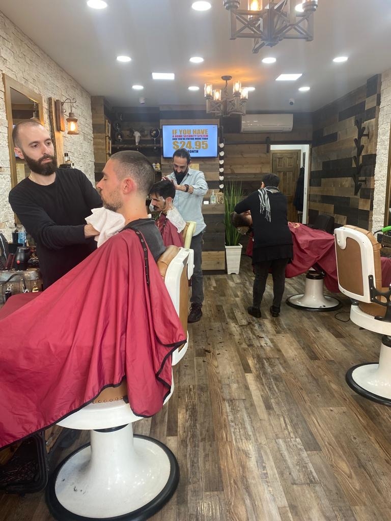 Are there any specific types of haircuts that are best suited for the clipper-over-comb technique?