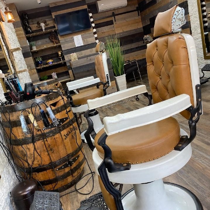 Are there any specialized tools or products that can enhance the results of the clipper-over-comb technique?