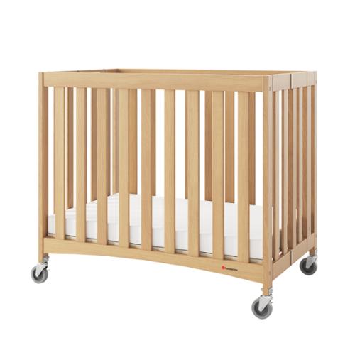 Foundations® Compact Travel Sleeper® Folding Crib, Slatted with Oversized Casters And Foam Mattress, Natural Hardwood