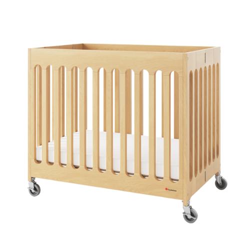 Foundations® Compact Boutique™ Folding Crib, Slatted with Oversized Casters And Foam Mattress, Natural