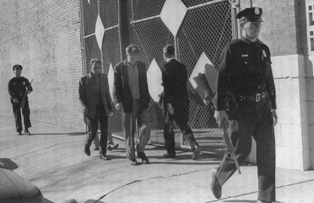 Photo of three tramps being arrested on the day of Kennedy's assassination - headstuff.org